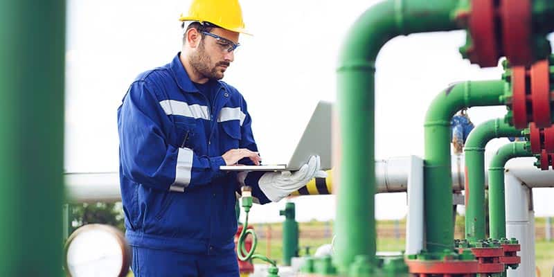 Maintenance Worker Checking Pipelines