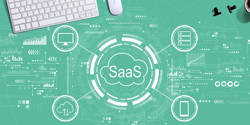 SaaS graphic over desk top